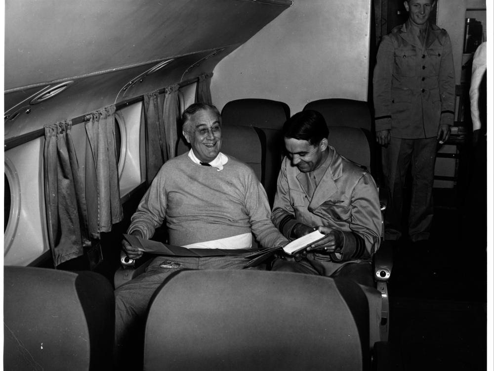 U.S. President Franklin Roosevelt sits in a plane seat as the first U.S. president to fly in a plane.