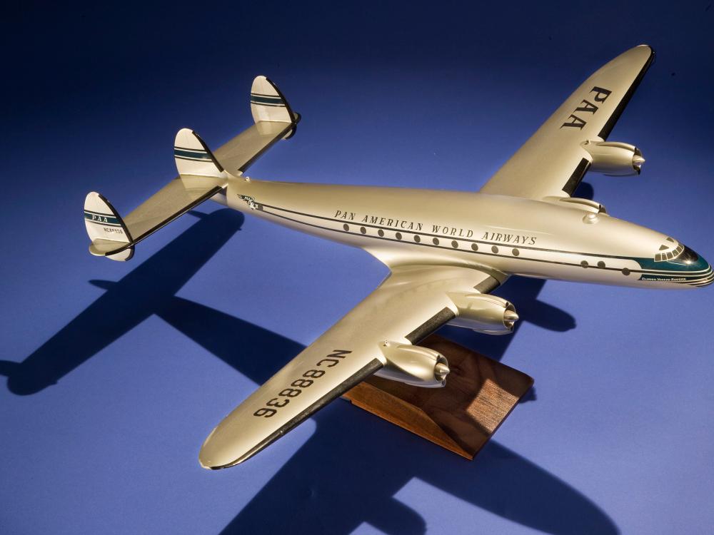 Commercial aircraft studio model on wooden stand. Pan American World Airways livery is seen on the fuselage and registration number NC88836 is on the right wing.