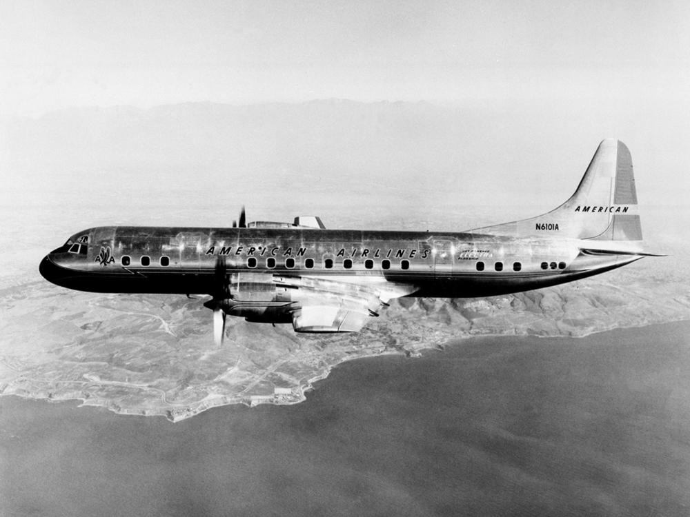 View of two-engine commercial aircraft in flight. Aircraft features American Airlines livery.