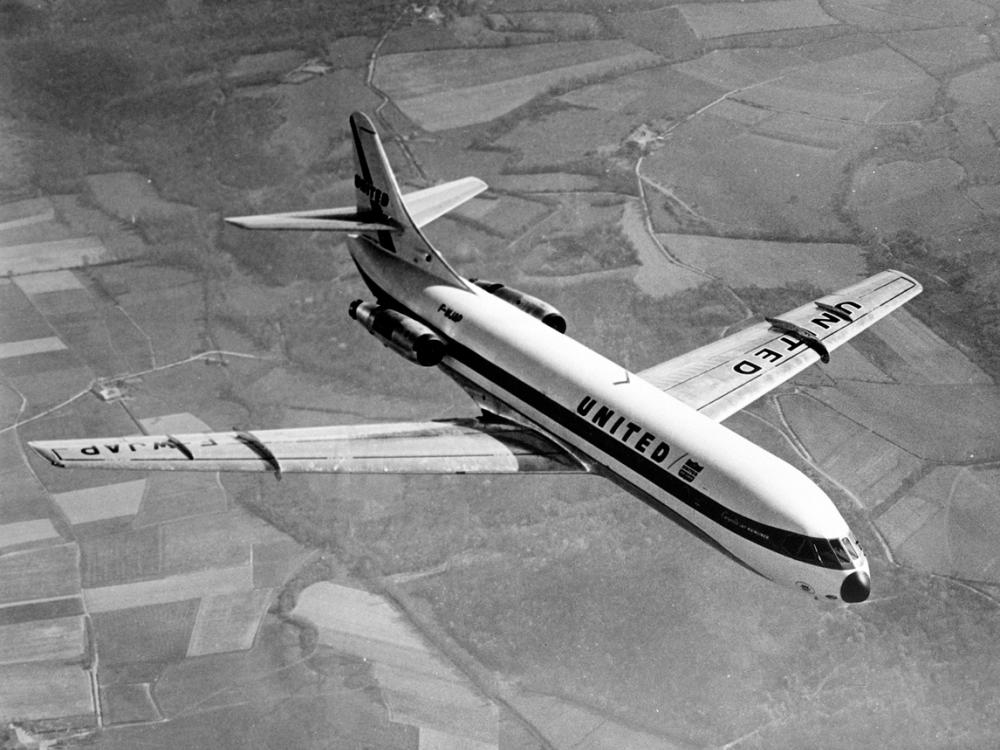 Top view of commercial aircraft with two engines, one each on the rear of the fuselage. Aircraft is in flight and features United Airlines livery.