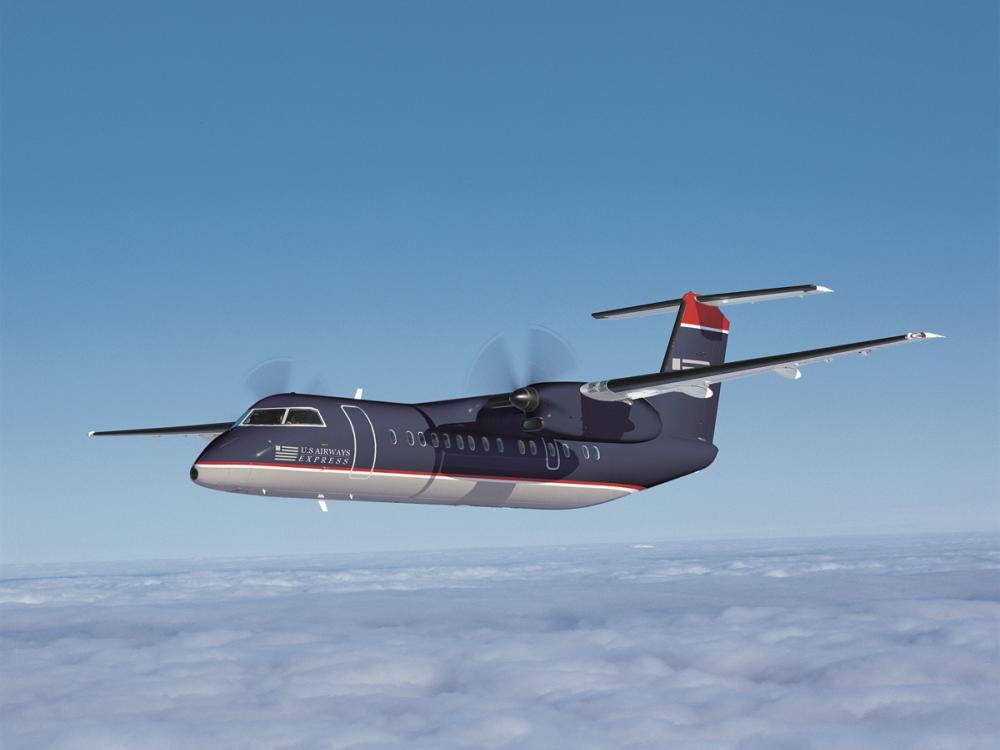 Side view of commercial aircraft in flight. The aircraft features two engines on the wings and dark blue and white US Airways livery.