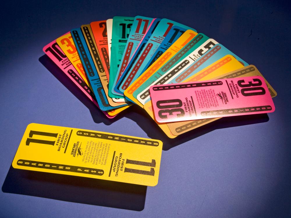 Set of twenty multi-colored, plastic, reusable boarding passes used by Southwest Airlines.