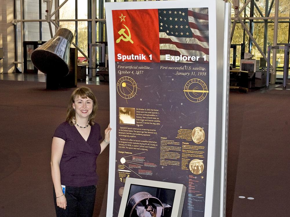 Margaret Weitekamp in front of Sputnik kiosk