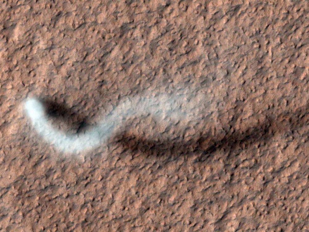 A large dust devil above the surface of Mars.