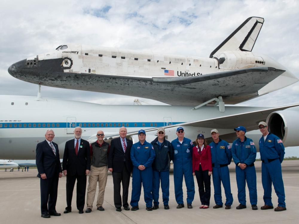 The people who transported the Space Shuttle Discovery using the Shuttle Carrier Aircraft pose for a photo following the flight.