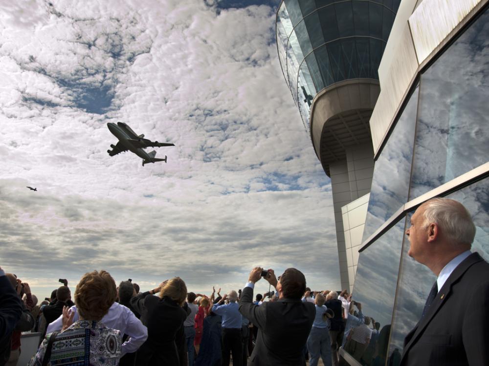 Space Shuttle Discovery passes by the Donald Engen Observation Tower