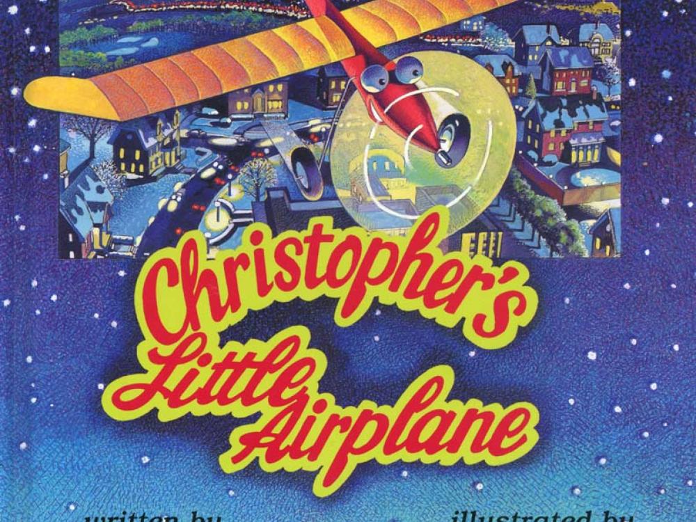 Book cover featuring a starry night sky above a farm background behind a monoplane flying above a town. Below the primary artwork, the title "Christopher's Little Airplane" is written in red and yellow colors.