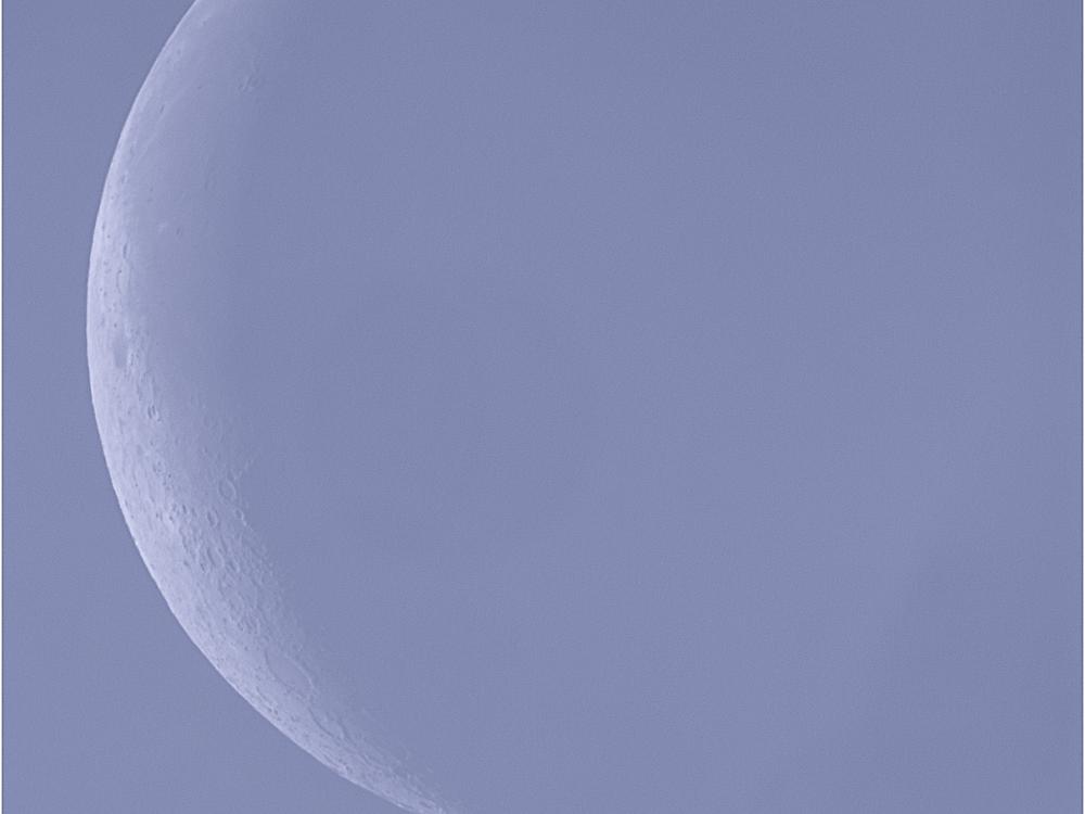 View of the Moon during waning crescent phase during daytime hours.