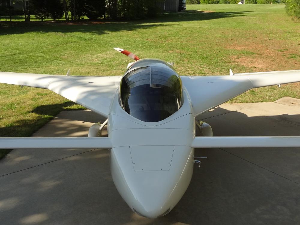 Front view of white homebuilt aircraft with single engine.