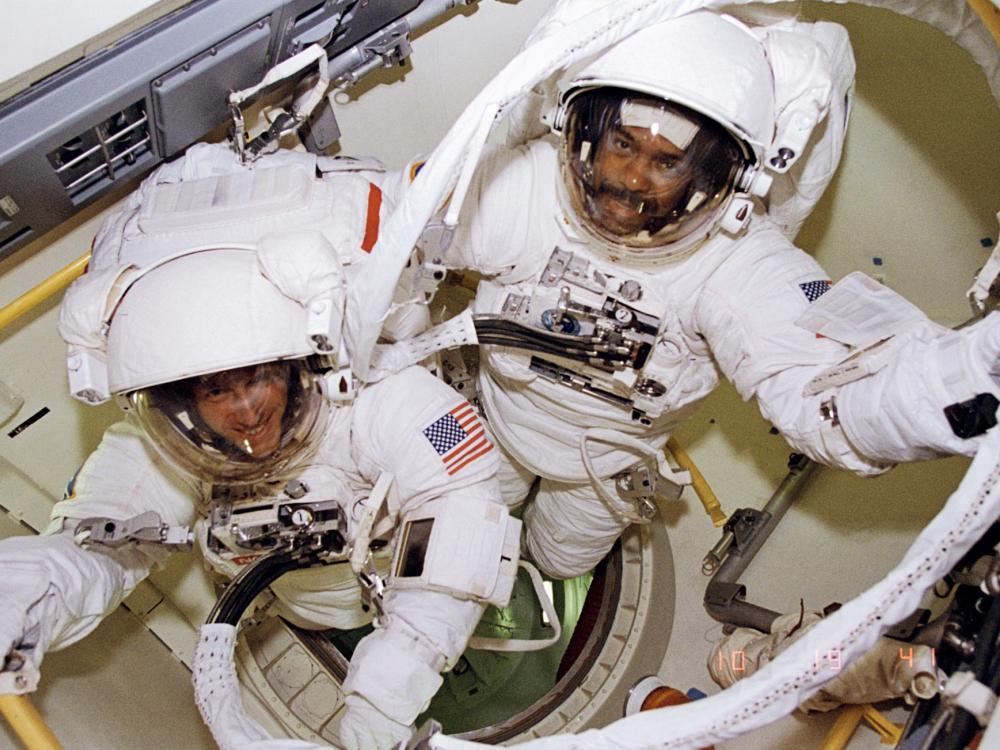 Bernard Harris and Michael Foale prepare to leave airlock 