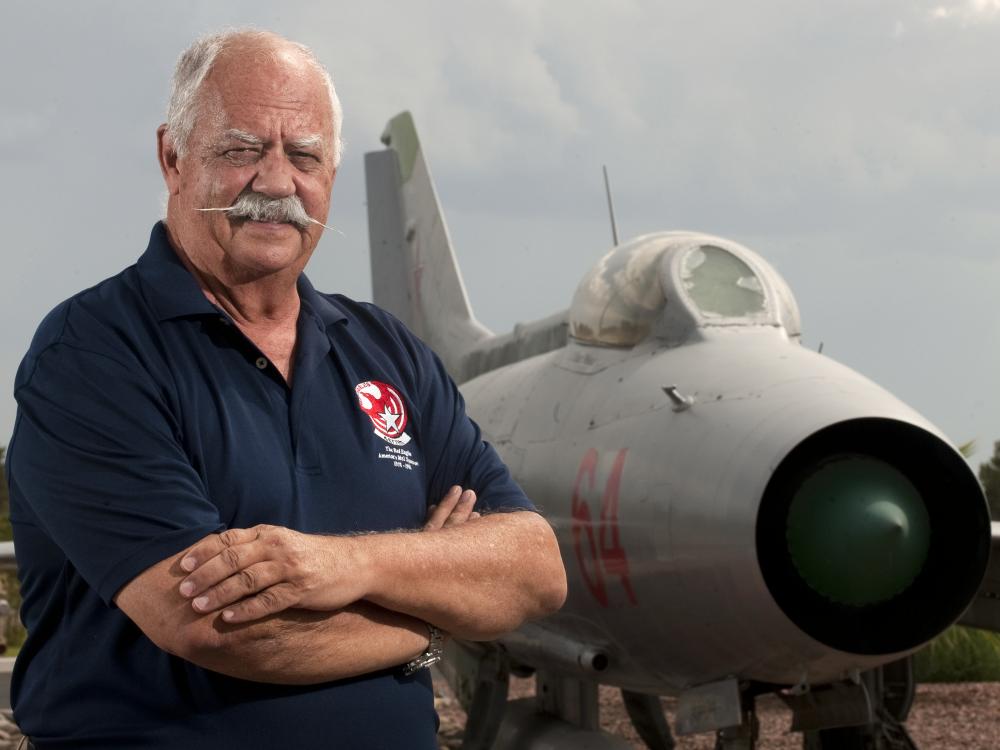 Portrait of Col. Gaillard R. Peck, Jr., USAF, a white man, in front of aircraft