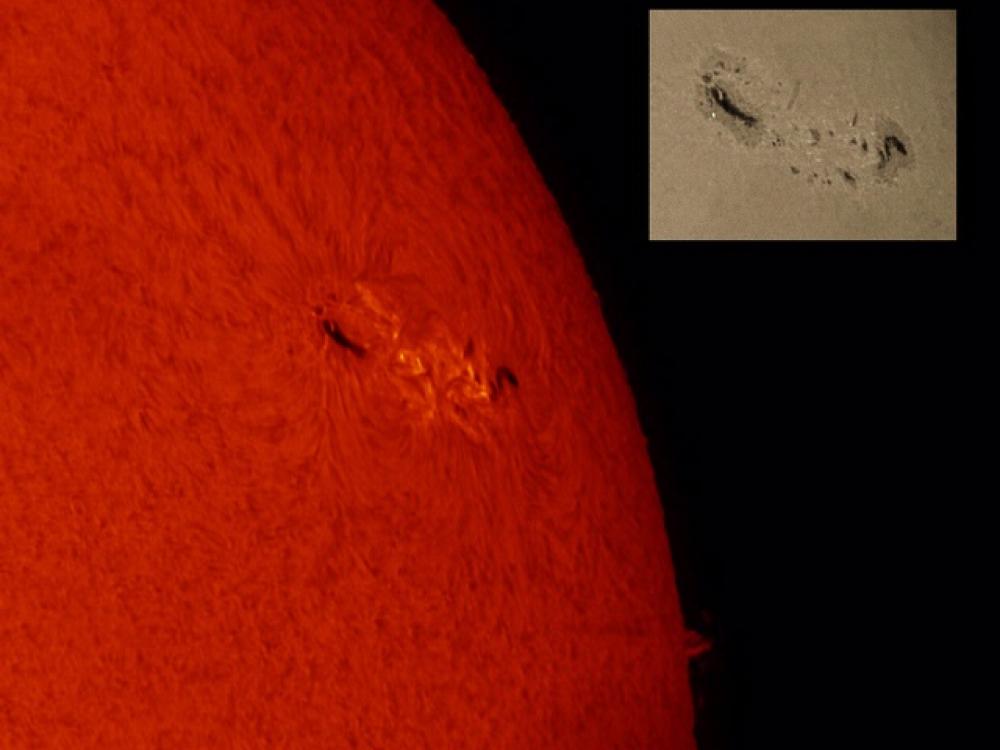 A partial disk view of the Sun's atmosphere is placed next to a small image of the Sun's surface. Both highlight a sunspot group visible as darker colored spots. A phage is visible on the atmospheric disk as lighter clouds near the sunspot group.