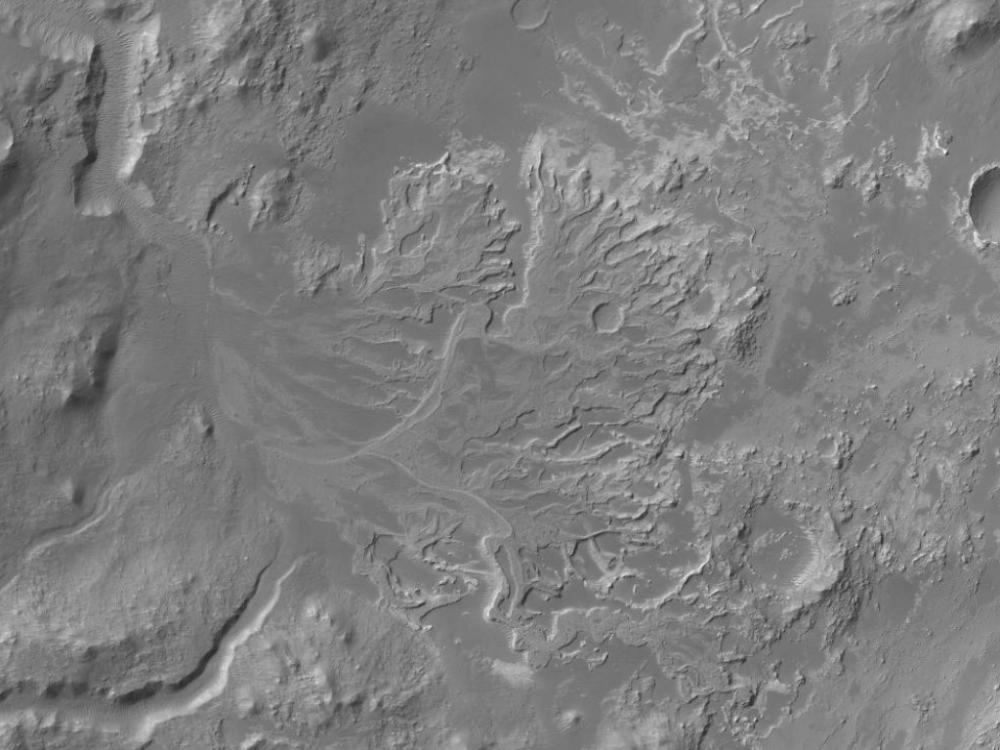 Satellite view of part of Mars's current landscape, featuring impact craters which once held bodies of water like rivers and lakes.