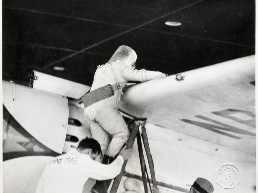 Wiley Post Climbing into the Winnie Mae with his Pressure Suit