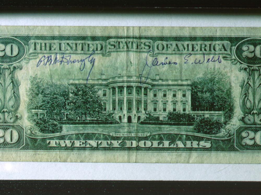 Back of a twenty dollar U.S. bill which was signed by Dr. George B. Kistiakowsky and James E. Webb.