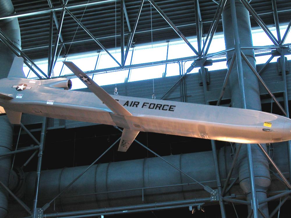 Silver-colored metallic missile with small set of center wings displayed in the Museum.