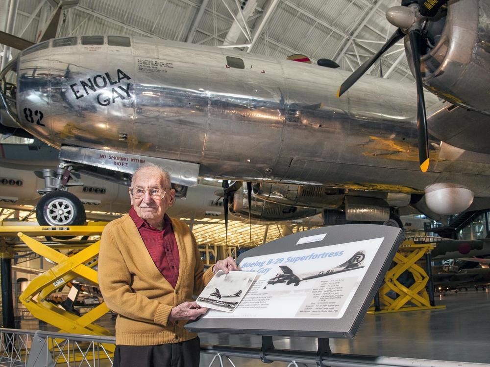 Max Desfor in front of the Enola Gay