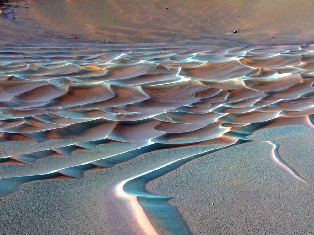 A area of rippling sand dune formations on Mars.