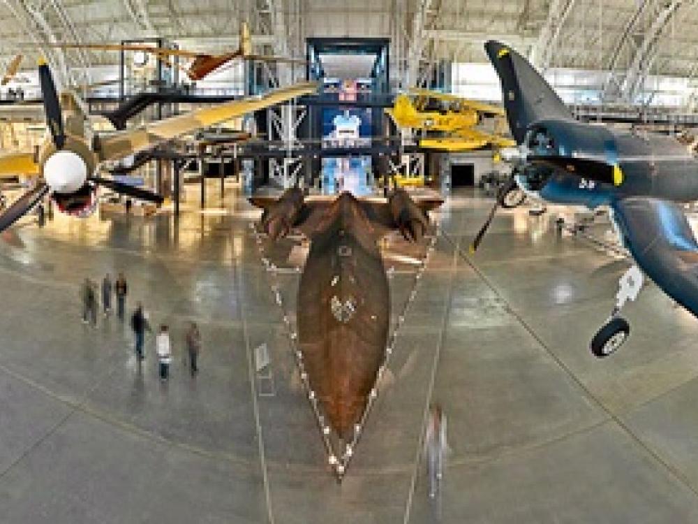 A view of several aircraft inside a section of the Udvar-Hazy Center, which is a large hangar full of aircraft.