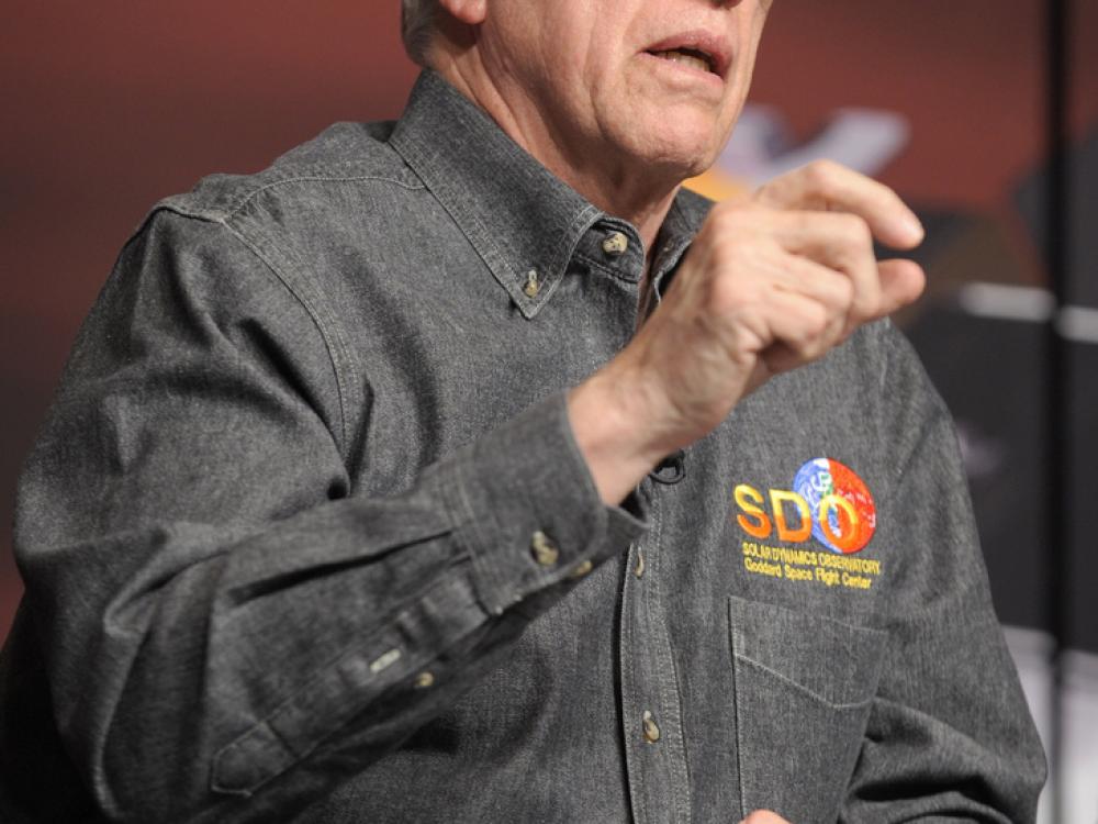 Richard Fisher, a white man, speaks during a briefing.