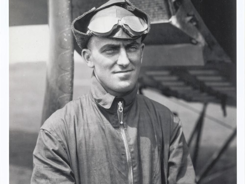 Lt. Oakley Kelly, a white man, stands while wearing aviator gear.