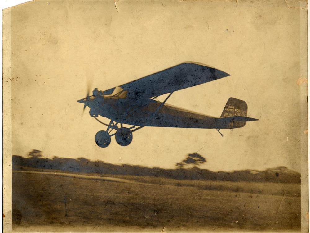 Monoplane with one engine. Monoplane is slightly above the ground.