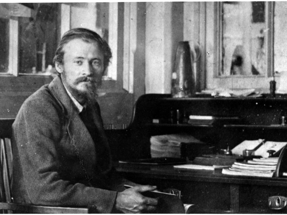 Friedrich Tsander, a white male physicist, sits near a desk.