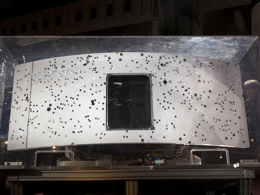 Rear end of planetary camera embedded in glass case.