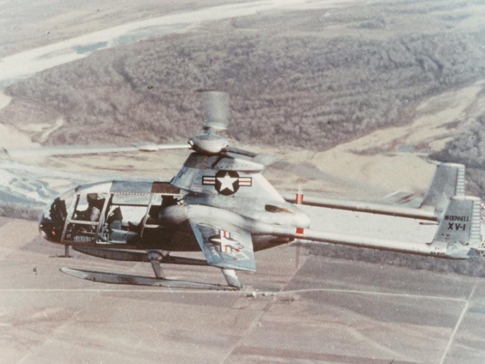 Side view of a gray, experimental aircraft designed like a helicopter but intended to have speeds similar to an airplane. A one-blade propellor is visible.