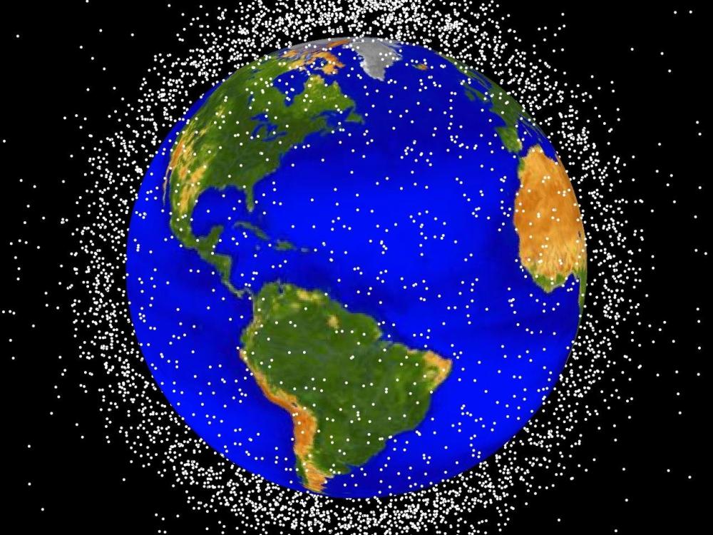 A view illuminating objects orbiting the Earth. Each white dot represents an object.