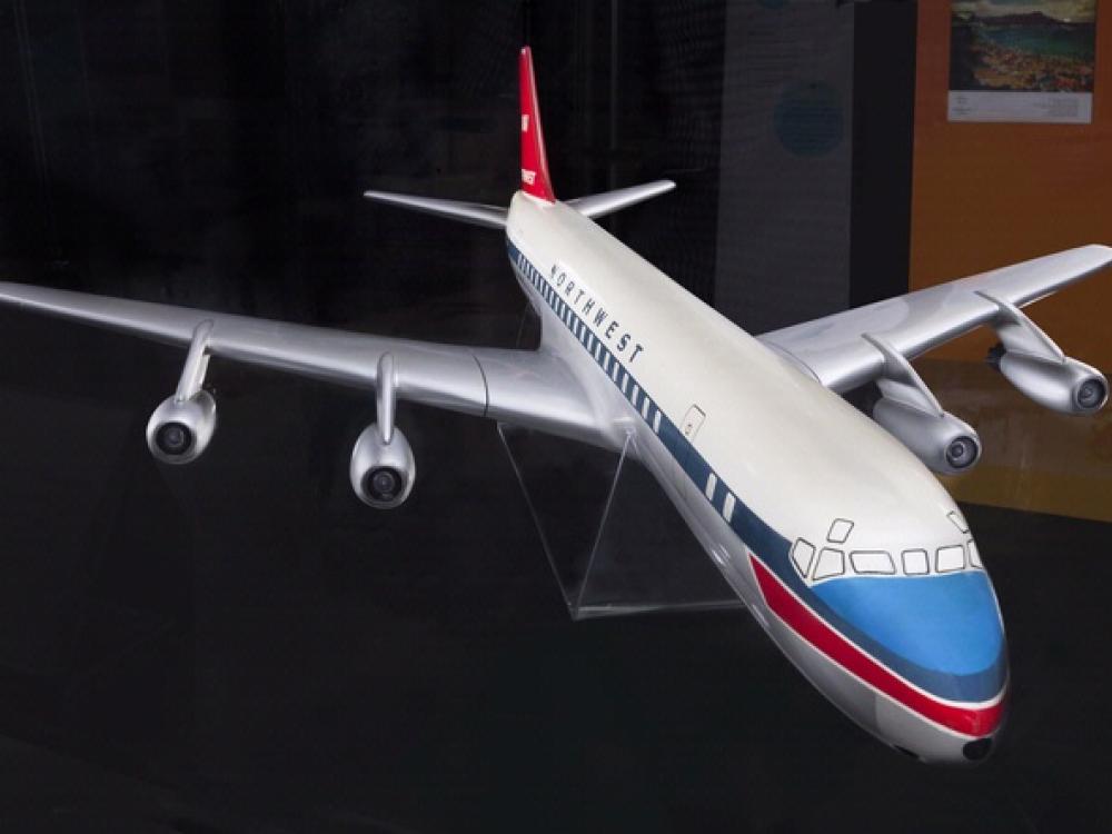 Front view of plastic commercial aircraft model with white, blue, and red livery. Northwest is painted on the side.