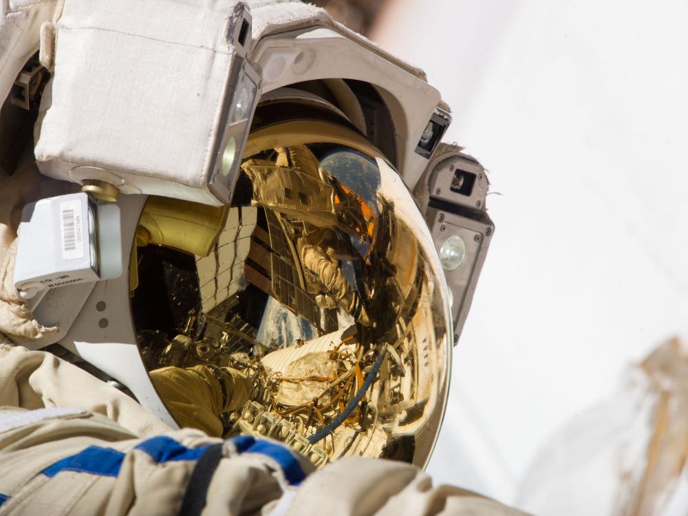 Close-up view of Cosmonaut Sergey Ryazanskiy, who is wearing his astronaut suit, during a spacewalk.