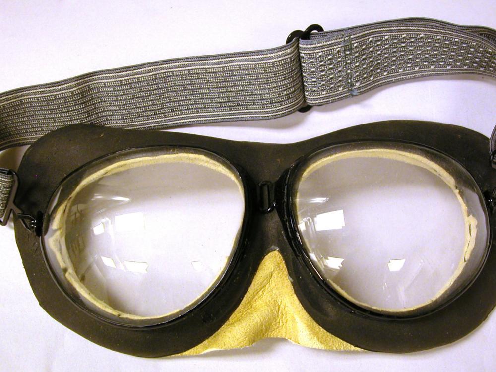 Black goggles with gray-colored fabric back strap.