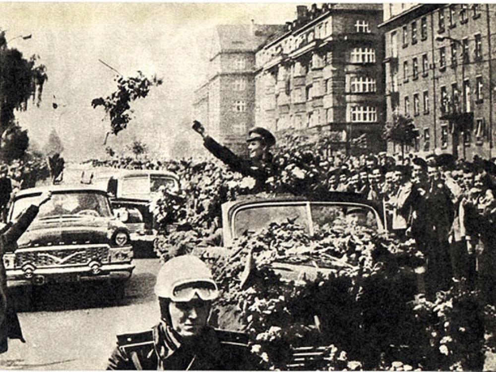 Gagarin waves to crowds en route to Red Square.