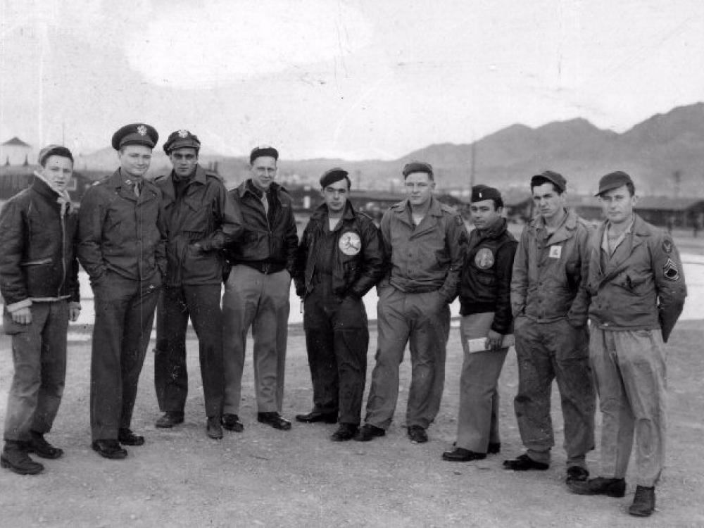 A group of U.S. Air Force soldiers who fought during World War II stand together.