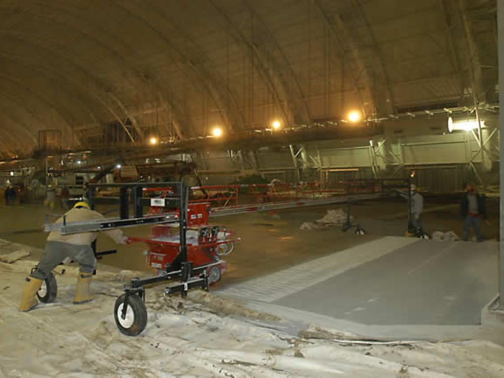 Preparing the floor of the Aviation Hangar