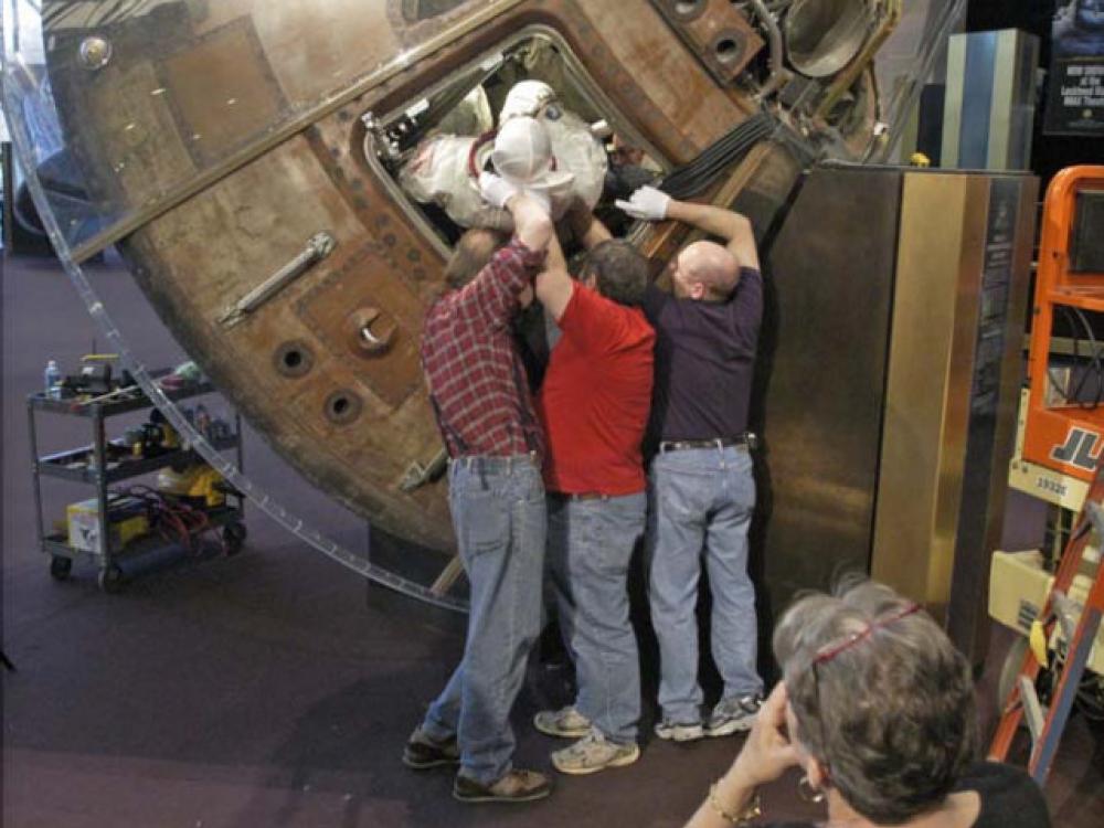 Collins Spacesuit Removal from Columbia