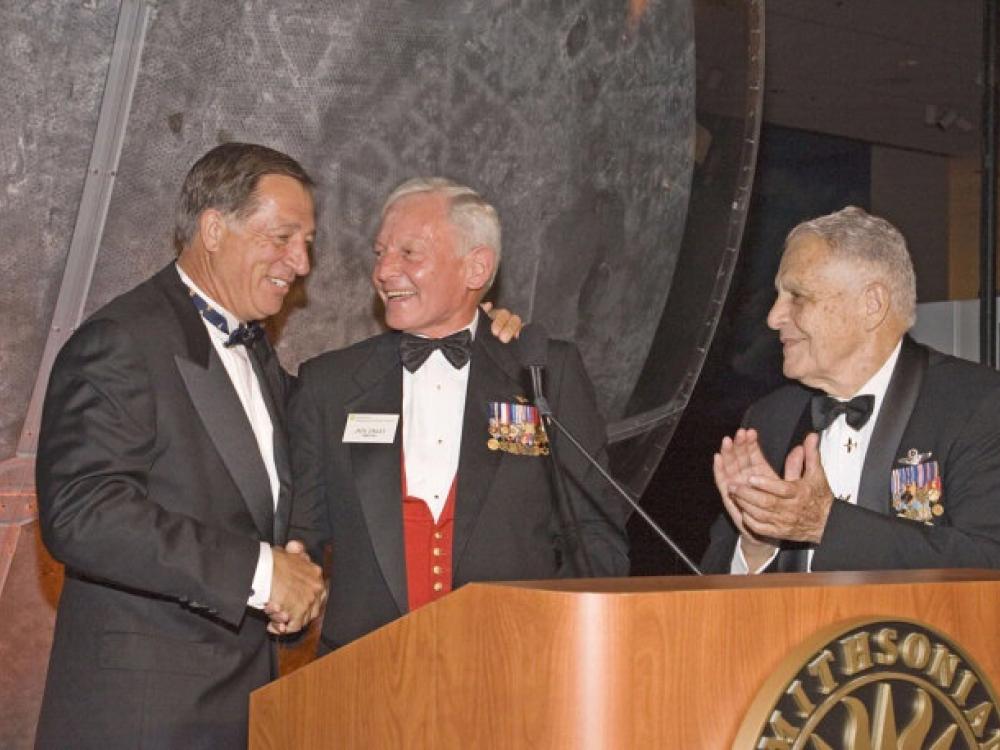 Jim Guyette, Jack Dailey and Don Lopez, three men, stand next to each other at a gala.