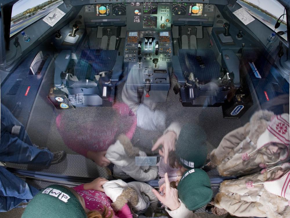 America by Air - cockpit reflecting children