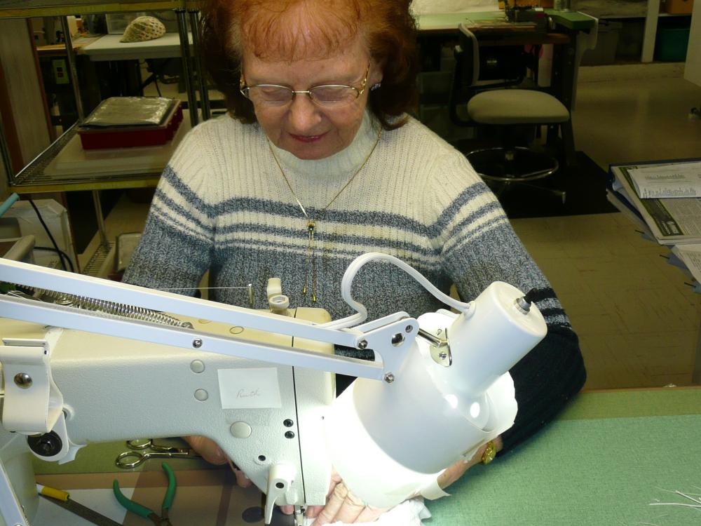 Ruth Ratledge repairing Spacesuit