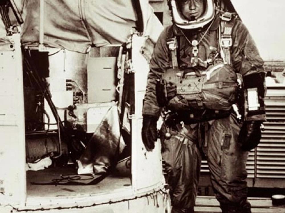 Joseph Kittinger suited and standing next to Excelsior gondola