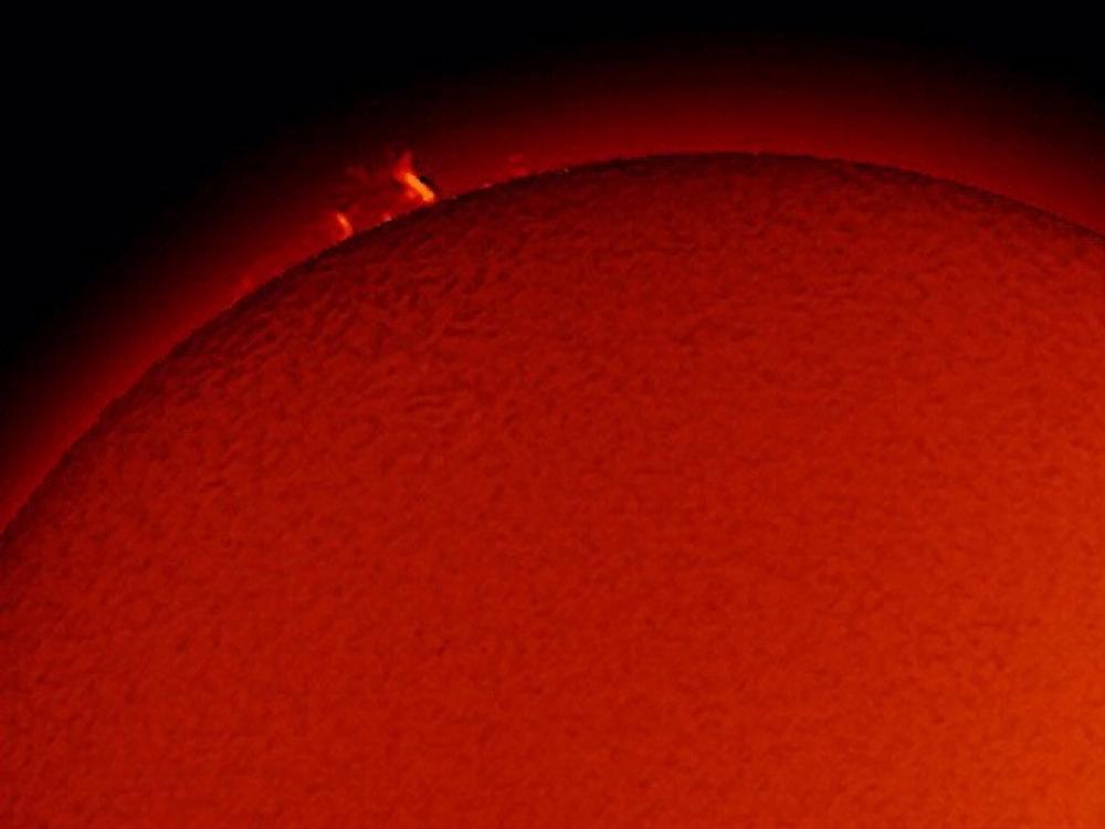 View of a prominence of plasma floating away from the Sun.