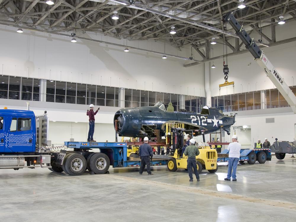 Staff Move <i>Helldiver</i> into Mary Baker Engen Restoration Hangar