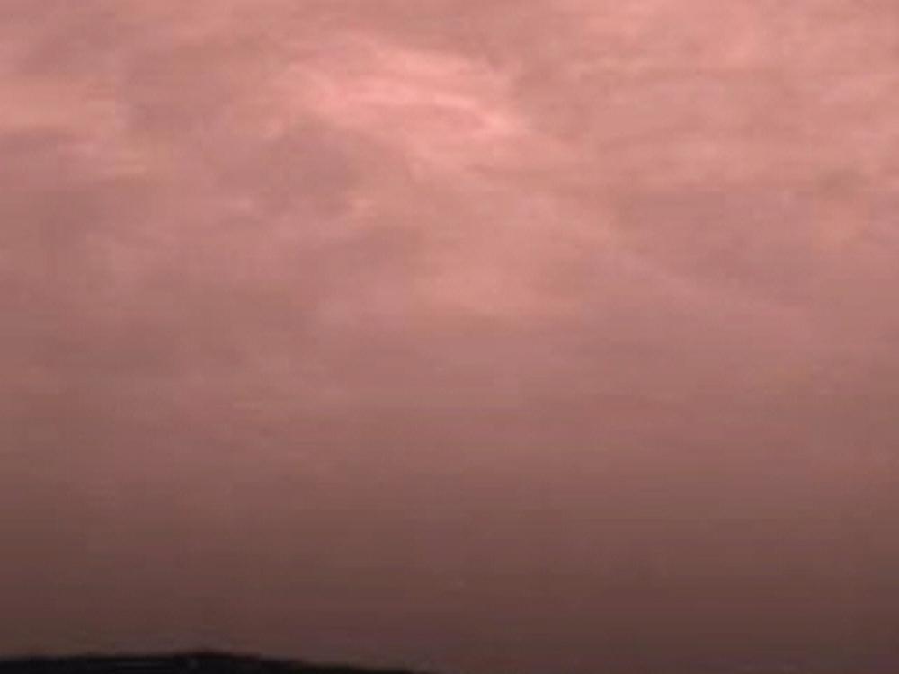 Pink stratus clouds in the atmosphere of Mars.