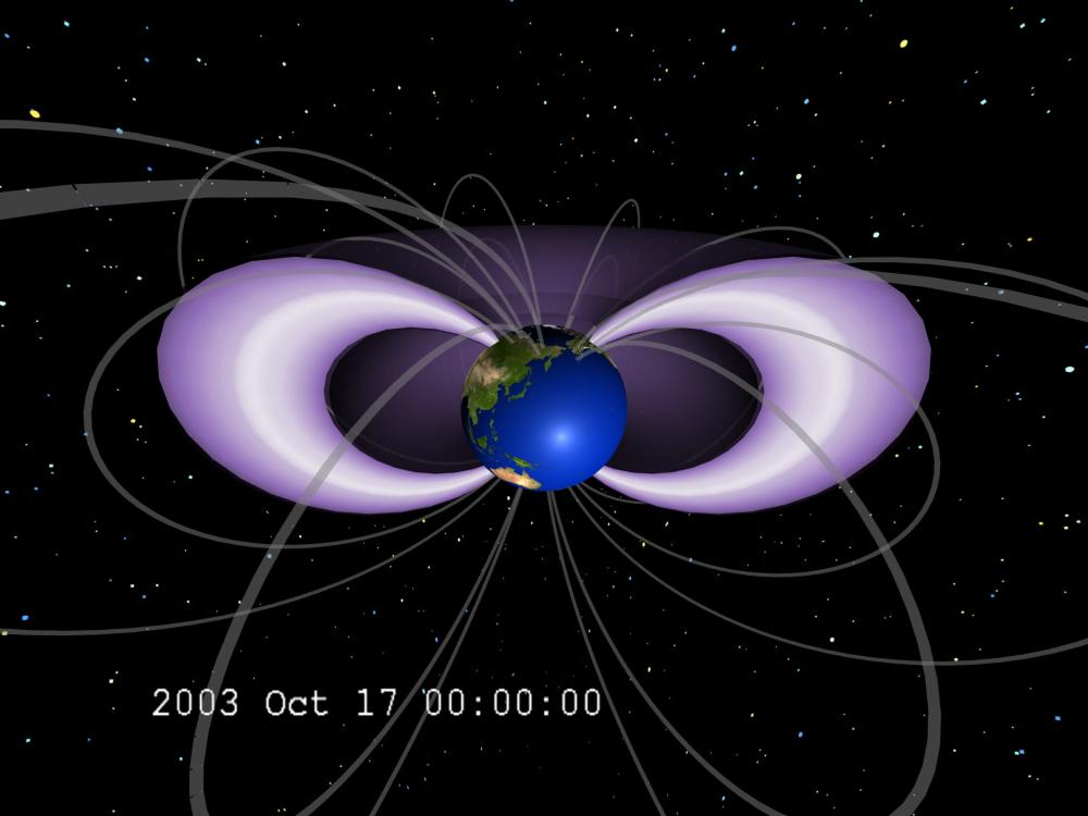 A visualization of two radiation belts surrounding Earth. The two belts are in purple and white.