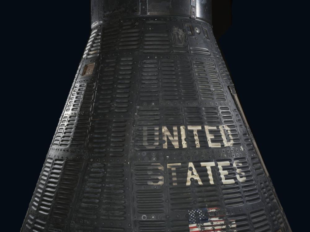 Gemini capsule with the words United States on the outside.