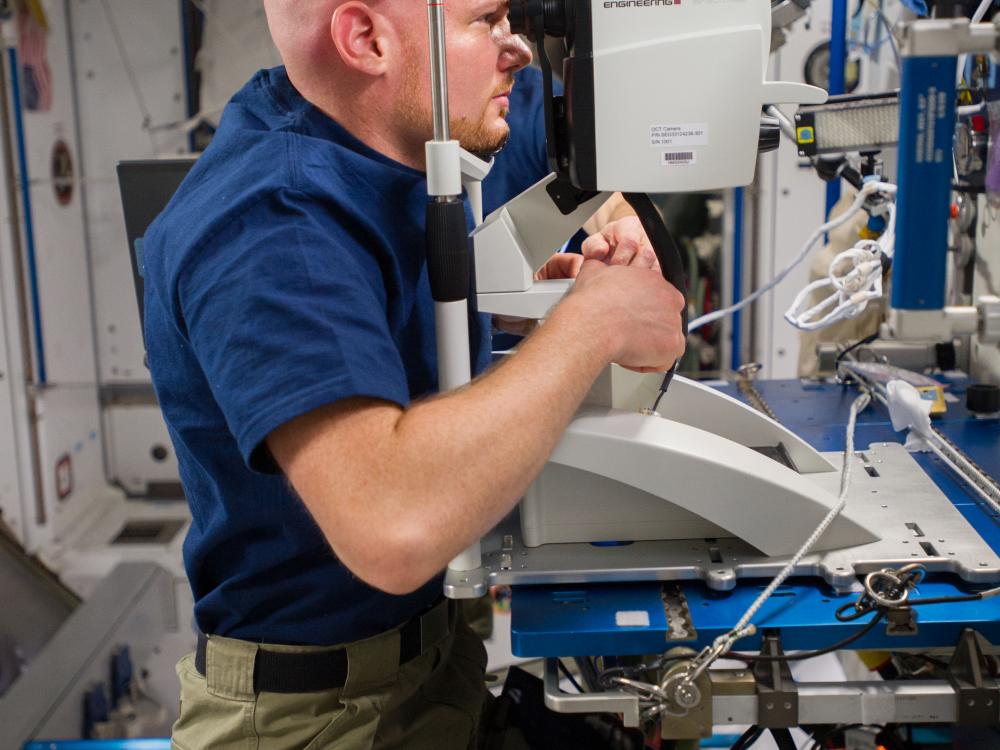 Astronaut does a vision test on the ISS. 