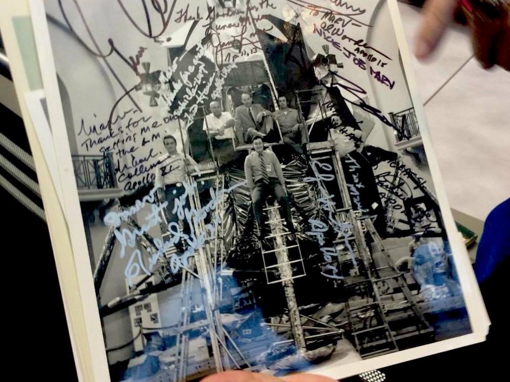 Close up of signed photographer in Marv's hands. 