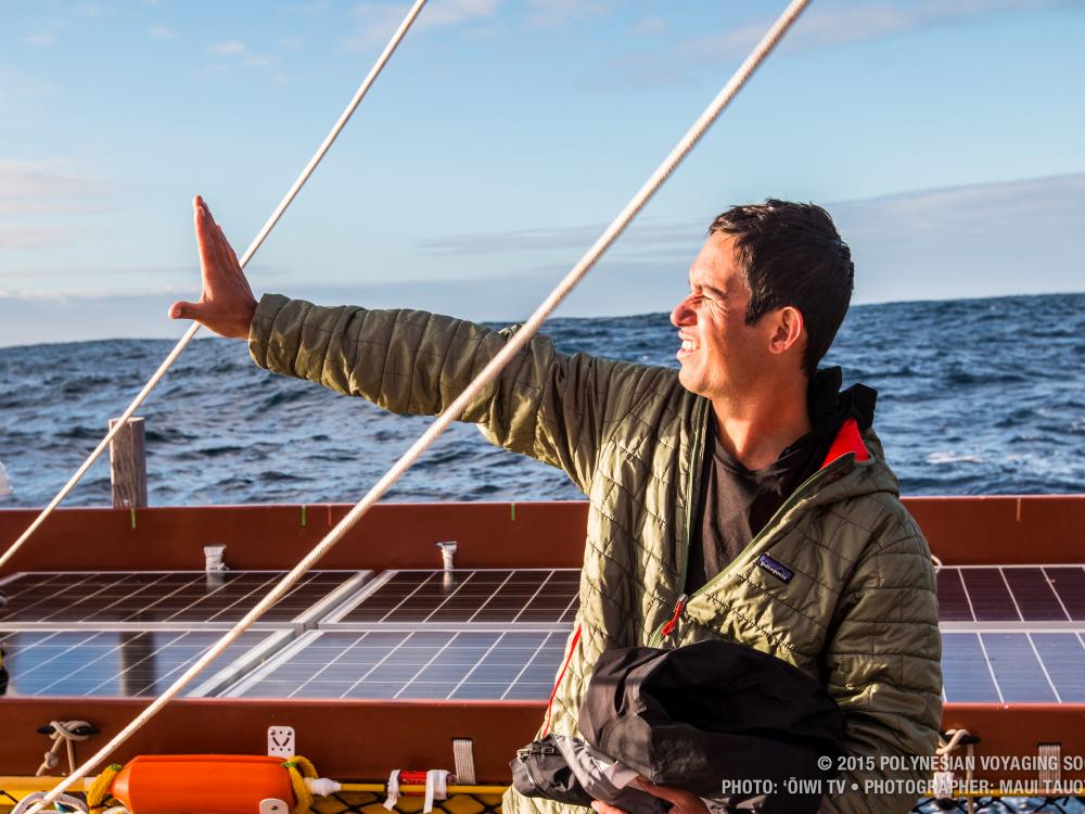 A person aboard a boat uses the position of the Sun to determine the direction of the boat's travel.