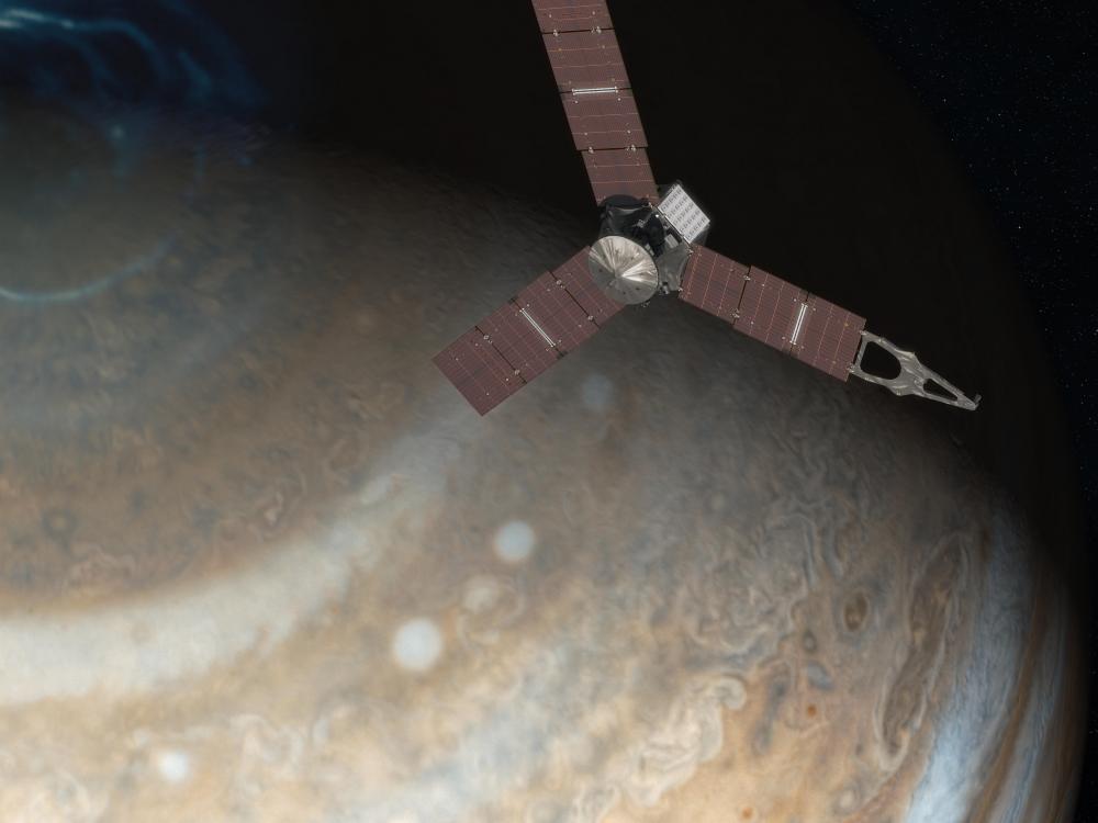 A rendering of the spacecraft Juno with Jupiter in the background. 